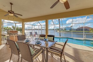 Outdoor dining - Sunrest102 1038 - 3Bd 3Ba Lake Front Home, electric heated Pool, south western exposure (Cape Coral)