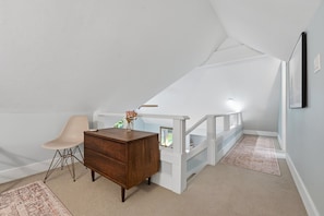 A room with a desk, chair, and a staircase. - Cozy Sapphire Retreat | Fireplace • Dog Friendly (Sapphire)