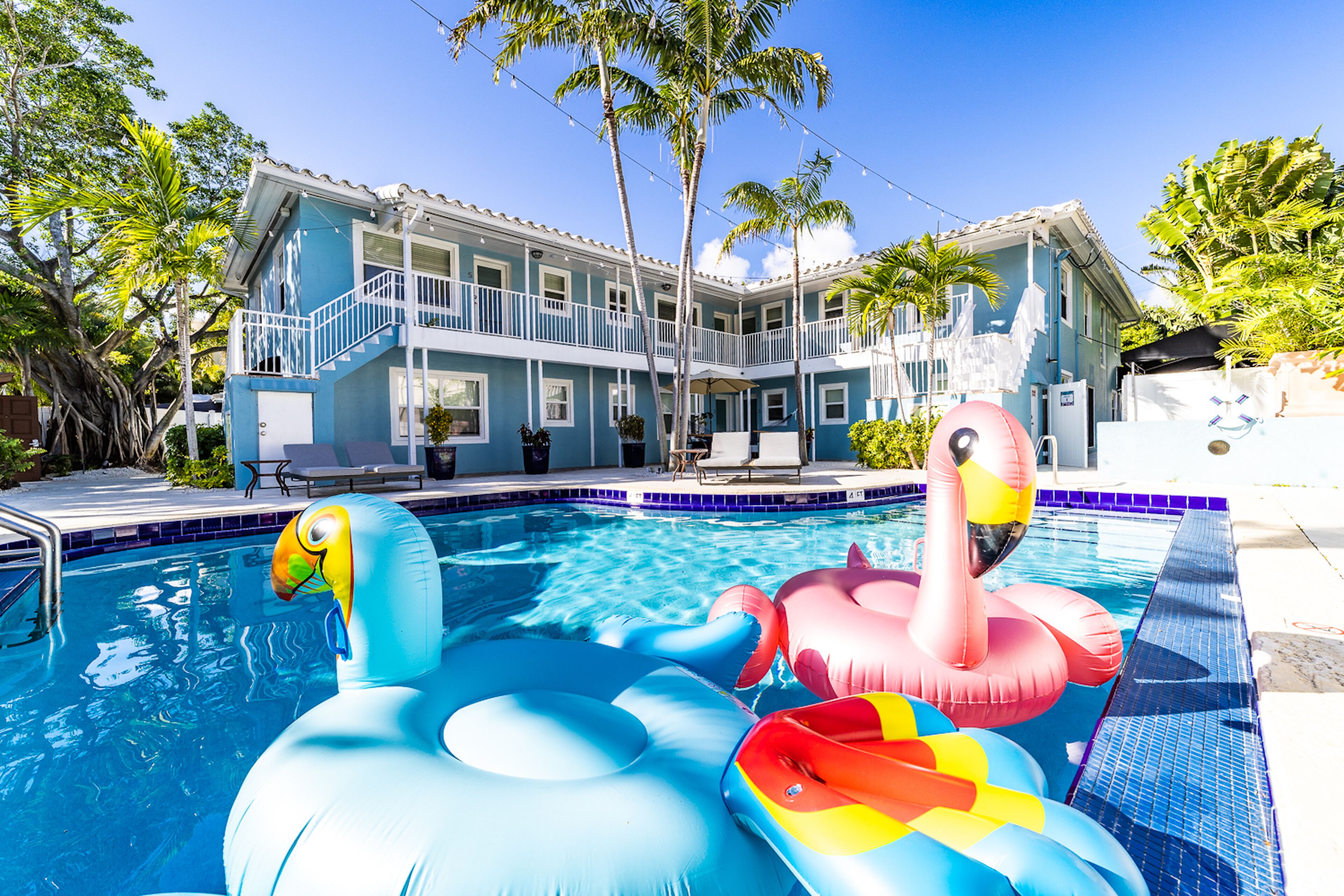 Outdoor pool, a heated pool, open 7:00 AM to 8:00 PM, pool umbrellas