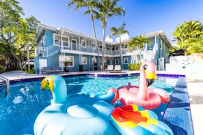 Outdoor pool, a heated pool, open 7:00 AM to 8:00 PM, pool umbrellas