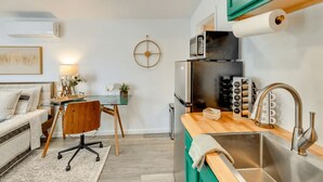 A compact kitchen with a microwave, refrigerator, and stainless steel sink. - Midterm Escape  Mountain Views & Desert Breezes (Palm Springs)