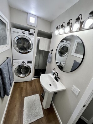 Shower, hair dryer, towels, soap