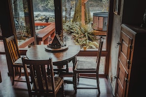 Enjoy meals in this inviting dining area with a round table and comfortable seating for four.