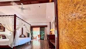 A room with a bed, a ceiling fan, and a view of the outside. -  Cruiser Island Resort by Swiss-Belhotel (Koh Lon)
