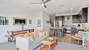 A modern apartment with a living room, dining area, and kitchen. - BeachBreak #6 Spacious+Luxurious Beachfront Suite

 (Imperial Beach)
