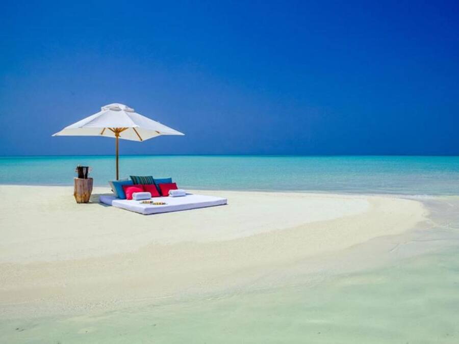 Een privéstrand, wit zand, duiken, waterskiën