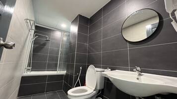 Shower, hair dryer, towels, toilet paper