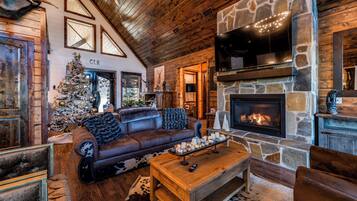 Een smart-tv, een open haard, tafelvoetbal en een muziekbibliotheek