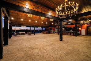 Interior - The Clubhouse is a refined sanctuary where celebration and rest coexist effortlessly. A grand lodge designed for gatherings, it welcomes weddings beneath soft lights, laughter by the fire, and mornings that unfold slowly. (BROKEN BOW)