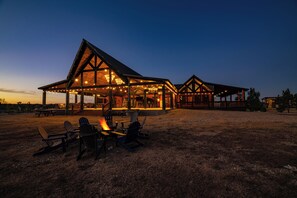 Outdoor dining - The Clubhouse is a refined sanctuary where celebration and rest coexist effortlessly. A grand lodge designed for gatherings, it welcomes weddings beneath soft lights, laughter by the fire, and mornings that unfold slowly. (BROKEN BOW)
