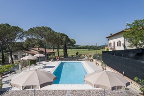 Seasonal outdoor pool, pool umbrellas, pool loungers