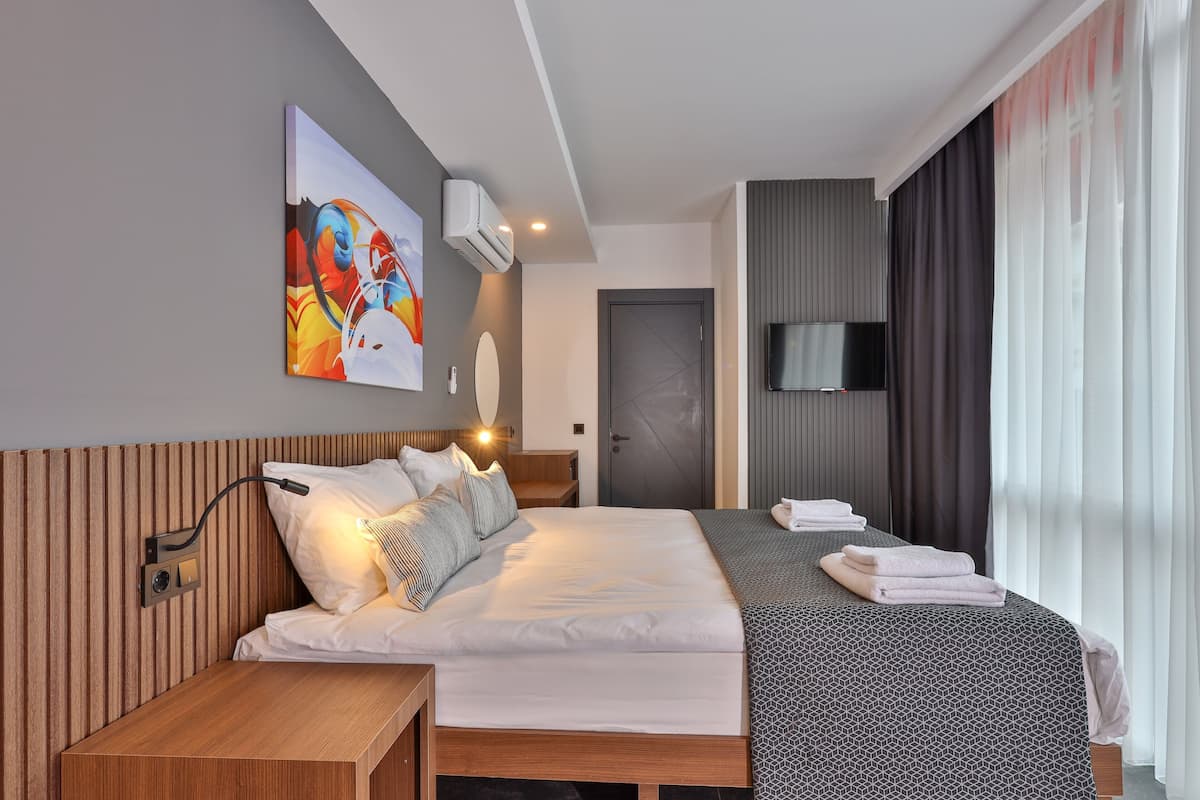 Standaard kamer | Een minibar, een laptopwerkplek, geluiddichte muren, gratis wifi