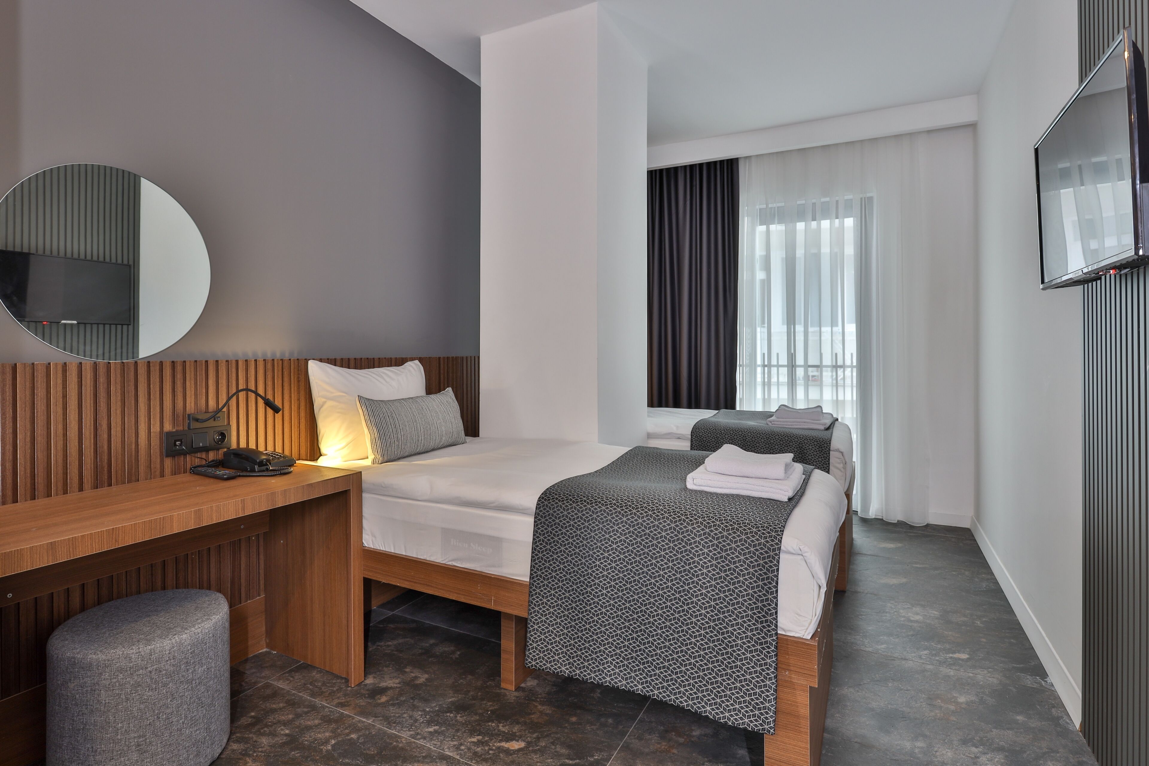 Standaard Twin kamer | Een minibar, een laptopwerkplek, geluiddichte muren, gratis wifi