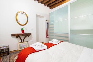 1 bedroom, desk, iron/ironing board, travel crib