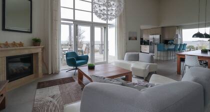 Exclusive 8-person Deluxe beach villa with panoramic views, freestanding bathtub, and steam shower cabin at Beach Resort Makkum on the IJsselmeer.