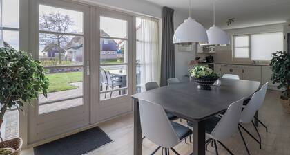 Spacious Deluxe Dune Villa for 8 persons with a private sauna and whirlpool, located at luxurious Beach Resort Makkum by the IJsselmeer.