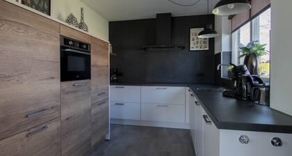 Detached fisherman's villa with sauna, bathtub, and patio above the water at Beach Resort Makkum on the IJsselmeer.