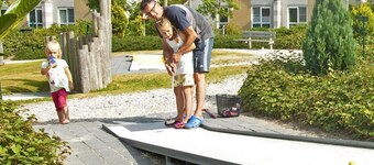 Detached 8-person fisherman's villa with a patio above the water and a private jetty at Beach Resort Makkum on the IJsselmeer.