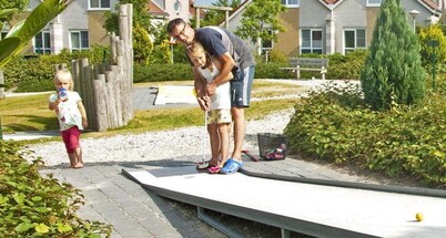 Detached 8-person fisherman's villa with a patio above the water and a private jetty at Beach Resort Makkum on the IJsselmeer.