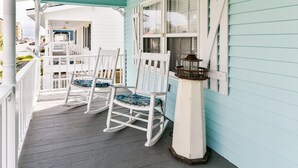 A porch with white rocking chairs and a lantern. - 3 BR walk to the beach house! Summer House 117    (Garden City)