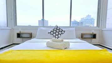 1 bedroom, desk, iron/ironing board, travel crib