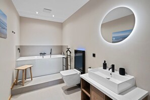 Bathtub, hair dryer, towels