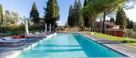 Seasonal outdoor pool, open 9:30 AM to 8:00 PM, pool umbrellas