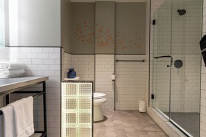 Designer toiletries, hair dryer, bathrobes, towels