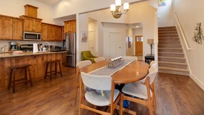 A spacious kitchen with wooden cabinets, a stainless steel microwave, and a built-in oven. - The Quails Nest - charming 3 bedroom 2.5 bath with fireplace in Sisters Oregon (Sisters)