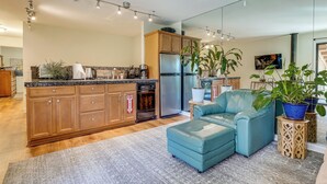 A modern kitchen with wooden cabinets, a stainless steel refrigerator, and a built-in dishwasher. - < 3 Mi to Lake Tahoe: Incline Village Condo! (Incline Village)