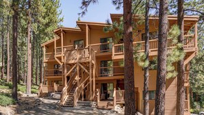 A multi-story lodge with a wooden exterior, multiple balconies, and a central staircase. - < 3 Mi to Lake Tahoe: Incline Village Condo! (Incline Village)