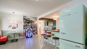 A retro diner with a vintage refrigerator, stools, and arcade games. - San Antonio Retreat w/ Private Hot Tub & Gas Grill (San Antonio)