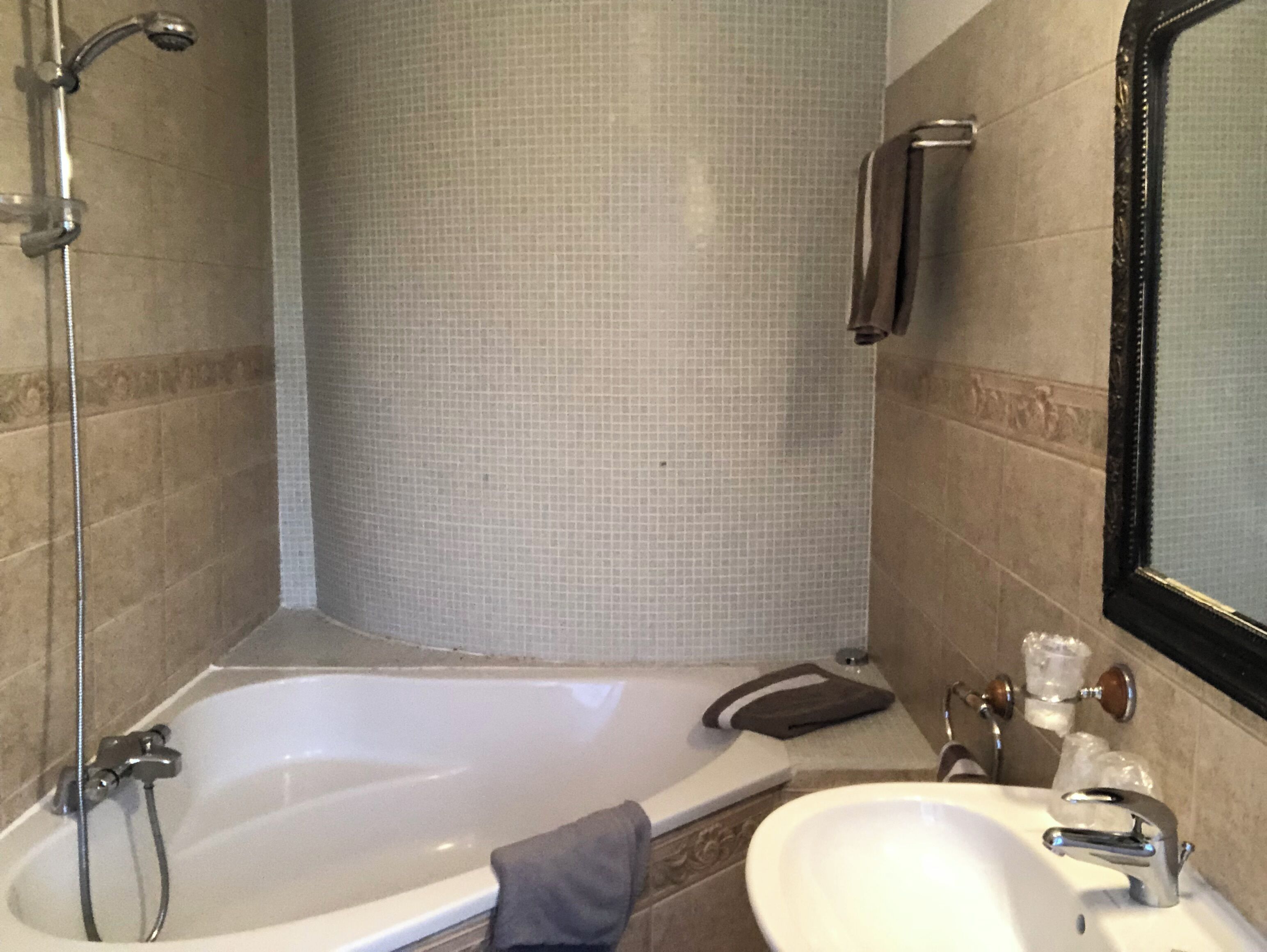 Bathtub, hair dryer, towels, soap