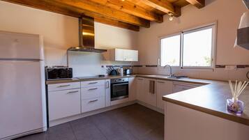 Microwave, oven, dishwasher, dining tables