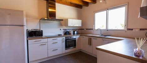 Microwave, oven, dishwasher, dining tables