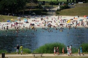 Guests can enjoy swimming, wading, and relaxing in the lake's calm waters.
