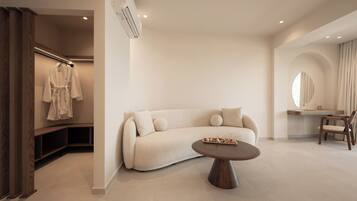 Deluxe Sea View Suite | Living area | 35-inch flat-screen TV with digital channels