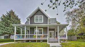 A two-story house with a front porch, a covered entryway, and a small front yard. - < 1 Mi to Dtwn Ludington: Bright Lower-level Unit (Ludington)