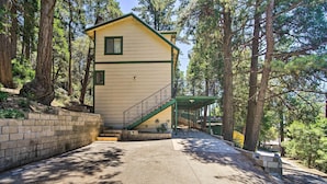 A two-story building with a green exterior and a staircase leading to the upper floor. - All-season Crestline Escape - 2 Mi to Lake! (Crestline)