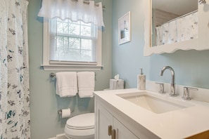 A bathroom with a white sink, a toilet, and a window with blinds. - 1 Mi to Beach: Quiet West Dennis Escape w/ Sunroom (West Dennis)