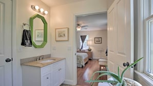 A bathroom with a sink, mirror, and towel rack. - Ashley Falls Home w/ Fire Pit: Hike & Ski! (Ashley Falls)