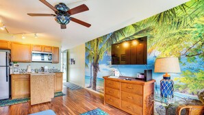 A kitchen with wooden cabinets, a microwave, and a ceiling fan. - Tropical Kailua-kona Escape < 7 Mi to Keauhou Bay! (Kailua-Kona)