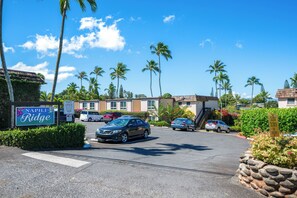 A parking area with a sign indicating reserved parking for the Napili Ridge.