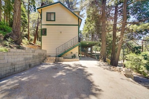 A two-story building with a green exterior and a staircase leading to the upper floor. - Cozy Crestline Getaway ~ 2 Mi to Lake Gregory (Crestline)