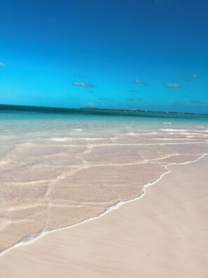 A beach with clear water and a distant shoreline. - 🇧🇸 GEAUX FISH Spanish Wells Sea Swings kayak beach snorkel gear! FREE GIFT 🏝️🩵💛🖤🇧🇸 (Spanish Wells)