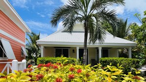 A two-story building with a white roof and a red exterior wall. - 🇧🇸 GEAUX FISH Spanish Wells Sea Swings kayak beach snorkel gear! FREE GIFT 🏝️🩵💛🖤🇧🇸 (Spanish Wells)