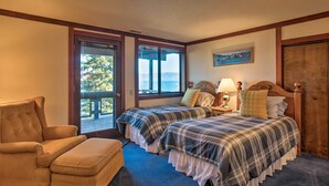 A bedroom with two beds, a chair, and a view of the outdoors. - 11 Mi to Palisades Tahoe: Lakefront Home w/ View! (Tahoe City)