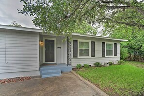A single-story house with a front porch, a small front yard, and a tree in the background. - San Antonio Home w/ Pvt. Yard, 5 Mi to Downtown! (San Antonio)