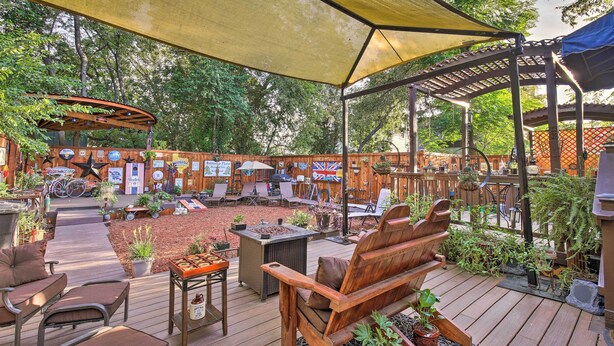An outdoor patio with wooden furniture, a barbecue area, and a covered seating area. - San Antonio Rental w/ Courtyard: Walk to Riverwalk (San Antonio)