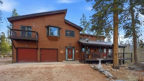 A two-story wooden house with a garage, a covered porch, and a stone pathway leading to the entrance. - Large Home on 1 Acre: 2 Mi to Grand Lake Village (Grand Lake)